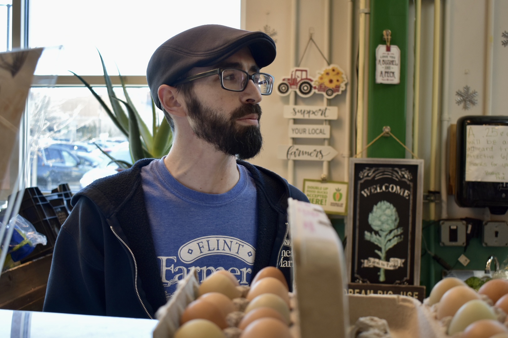 Clinton Beck, the owner of Bushels and Peck's in the Flint Farmers' Market, talks about the price of eggs.